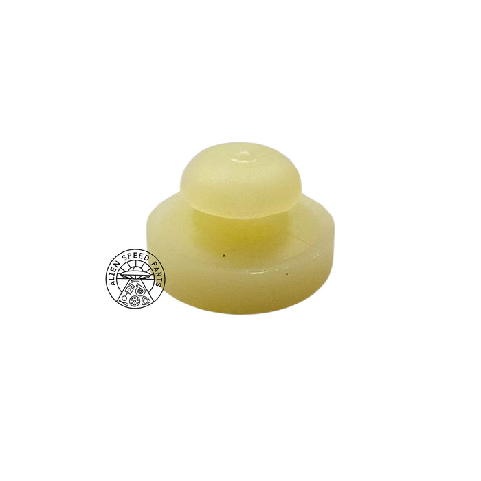 A pale yellow translucent plastic cap or plug with a rounded top and flat base, shown on a plain white background with a circular 'Fast Speed Parts' watermark on the left.