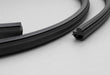 A close-up studio shot of a black rubber weatherstrip or seal, showing its profile and cross-section on a light gray background. Nissan pulsar gtir sun roof seal