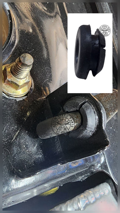 Close-up of mechanical components with a small inset showing a black rubber bushing. Bonnet rod bush